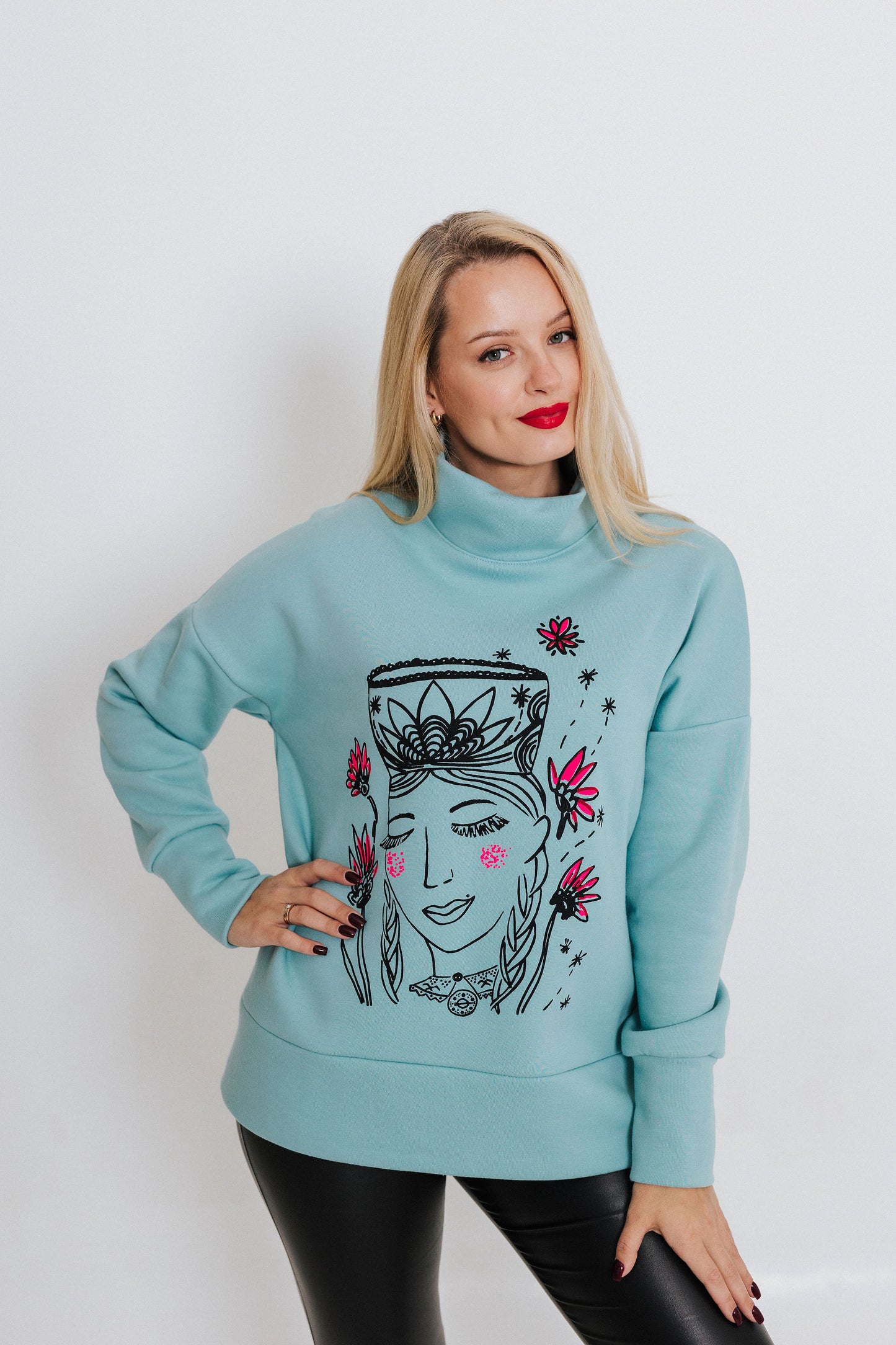 Oversized sweatshirt printed in manual screen printing technique. It's designed with a high mock neck, relaxed dropped shoulders.